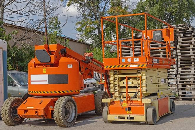 forklift transporting goods in a busy warehouse setting in East Freetown, MA